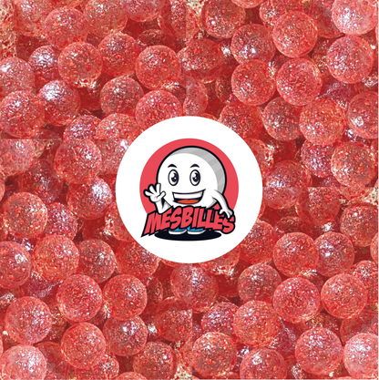 Image de la Mascotte MesBilles entourée de Billes Pépite en verre translucide avec éclats ROUGE 22 mm